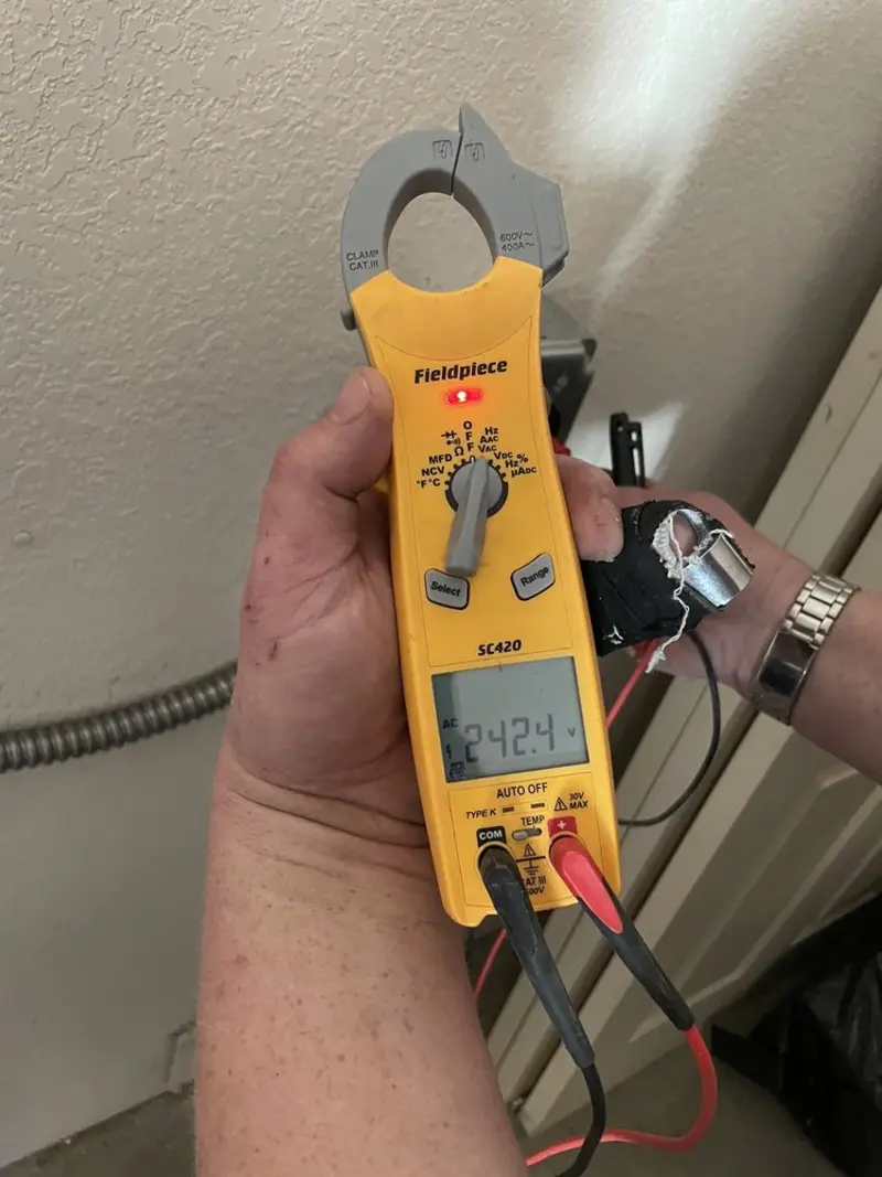 Voltage testing with clamp meter during Whole House Surge Protector in Union Beach